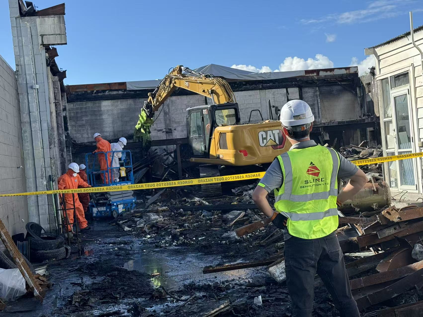 SLINE workers operating within a controlled damaged site